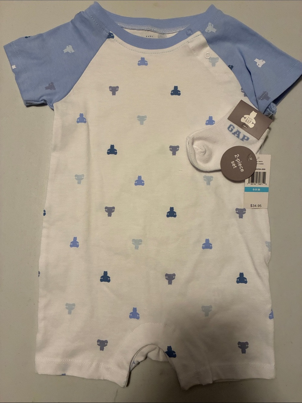 GAP White One-Piece Bodysuit with Light Blue Raglan Sleeves and Blue Motifs